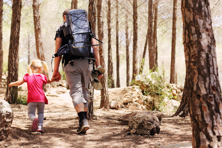 Father hiking with daughter